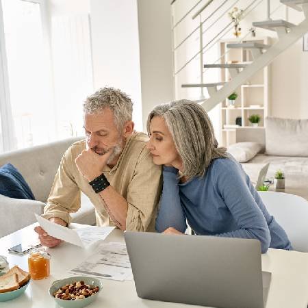 Couple sitting down reviewing their pension savings