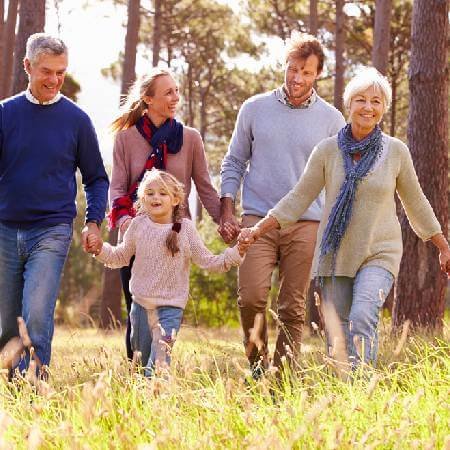 Grandparents out for a walk with grandchildren | Factors that could affect your pension