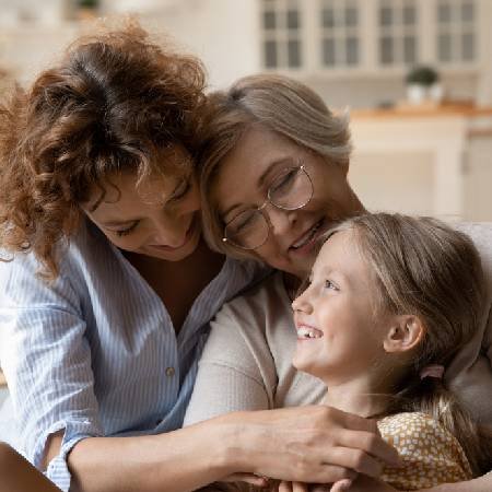 Grandmother hugging her granddaughter