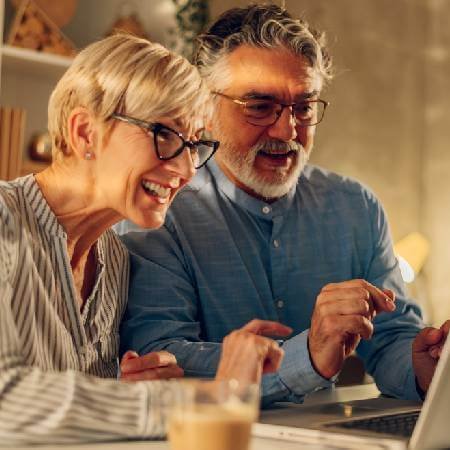 Smiling couple | Tips for increasing retirement savings