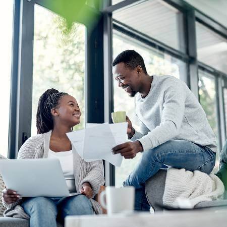 Couple sitting down reviewing their finances